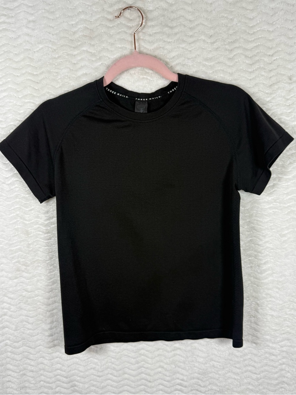 Three Nails Seamless Essential Black Short Sleeve Performance Tee.